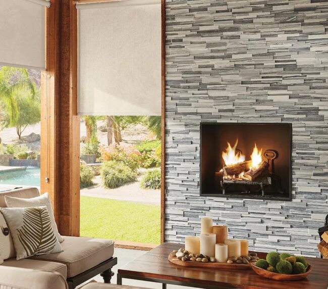 exterior shades shown in a covered back patio with a fireplace