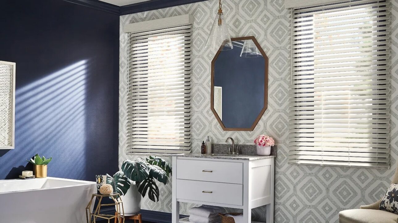 Light grey faux wood blinds in a master bathroom
