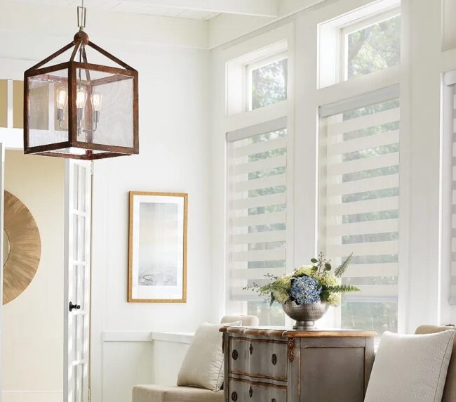 White layered shades in a formal entryway of a traditional home