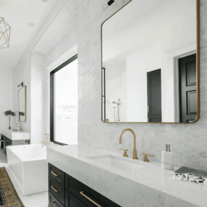 Bathroom solid stone vanity counter with grey hexagonal backsplash