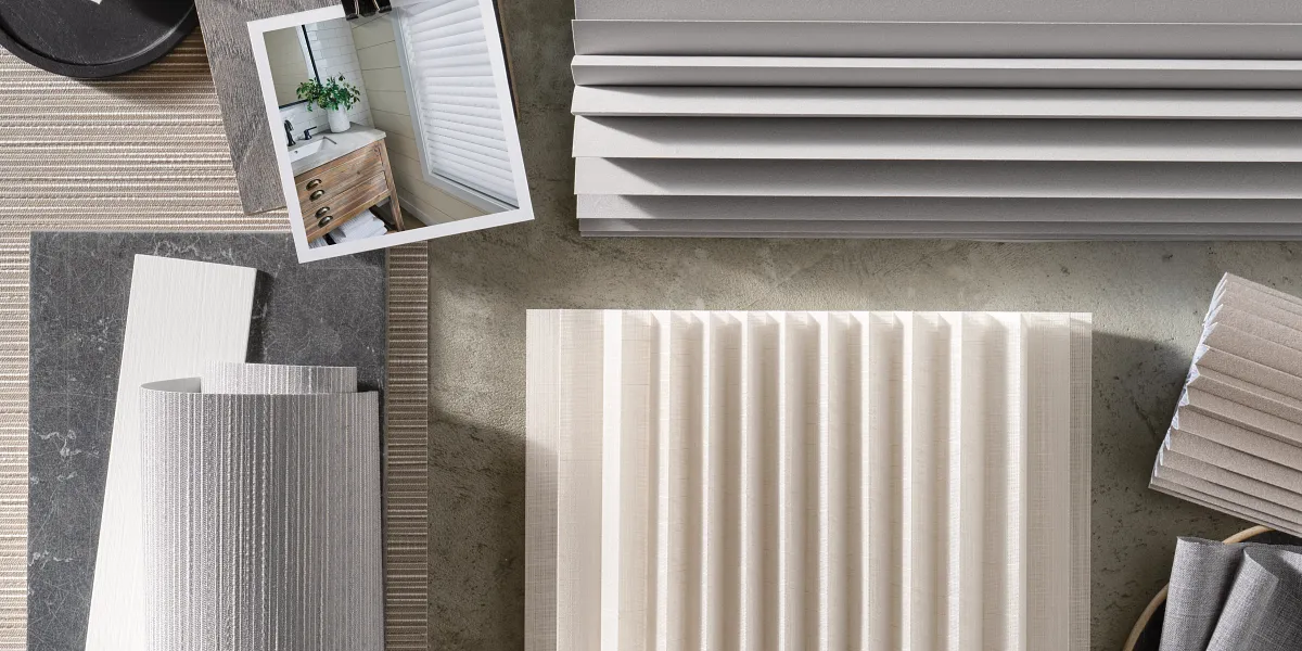 picture of various window treatment swatches on a table
